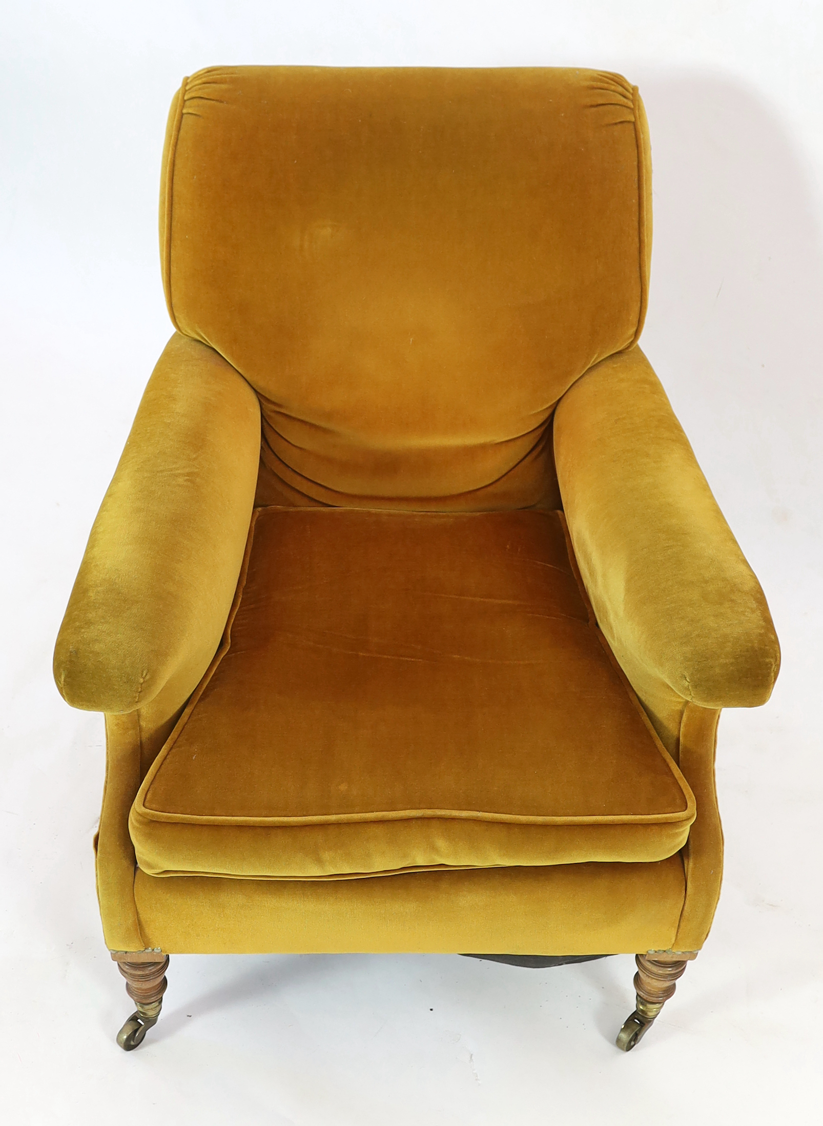 A late Victorian Howard & Sons upholstered armchair